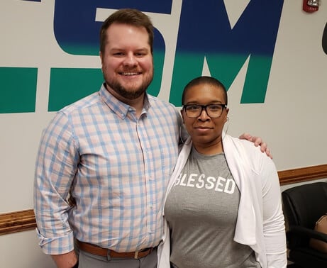 Nafeteria standing next to her therapist.